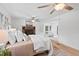 Bedroom with a brick fireplace, light wood floors and lots of natural light at 307 Country Club Dr, Durham, NC 27712
