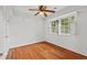Bedroom features hardwood floors, natural light, and ceiling fan at 307 Country Club Dr, Durham, NC 27712