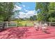 Spacious deck featuring plenty of seating with peaceful views at 307 Country Club Dr, Durham, NC 27712