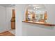 View of kitchen and breakfast bar featuring hardwood cabinets and stainless steel appliances at 307 Country Club Dr, Durham, NC 27712
