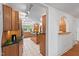 Spacious kitchen with cooktop island, hardwood cabinets and view of the breakfast bar at 307 Country Club Dr, Durham, NC 27712