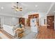 Spacious living room with hardwood floors, custom built-in shelving, and bright, neutral décor at 307 Country Club Dr, Durham, NC 27712