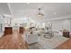 Spacious living room with hardwood floors, a vaulted ceiling, and a comfortable seating area at 307 Country Club Dr, Durham, NC 27712