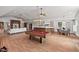 Spacious recreation room featuring an open layout with pool table, bar, living space, and dining area at 307 Country Club Dr, Durham, NC 27712