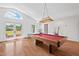 Recreation room featuring a pool table and french doors leading to the outdoor space at 307 Country Club Dr, Durham, NC 27712