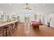 Spacious recreation room with bar, pool table, and access to the backyard at 307 Country Club Dr, Durham, NC 27712