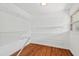 Empty walk-in closet with hardwood floors and wire shelving at 307 Country Club Dr, Durham, NC 27712