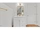 Bathroom featuring a white vanity with gold hardware, a gold mirror, and light fixture in the space at 314 Lane Rd, Dunn, NC 28334
