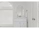 Bathroom with white vanity, arched window with view, and chrome hardware at 314 Lane Rd, Dunn, NC 28334