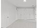 Bedroom with large closet doors featuring neutral carpet and fresh white paint throughout the room at 314 Lane Rd, Dunn, NC 28334