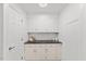 A butlery including counter space, white cabinets, subway tile backsplash, and white walls at 314 Lane Rd, Dunn, NC 28334