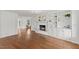 Bright living room featuring hardwood floors, built-in bookshelves, and a cozy fireplace at 314 Lane Rd, Dunn, NC 28334