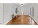 Living room featuring hardwood floors, neutral paint, and natural light from windows and French doors at 314 Lane Rd, Dunn, NC 28334