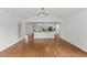 Bright, airy living room with hardwood floors and an open floor plan flowing into the kitchen at 314 Lane Rd, Dunn, NC 28334