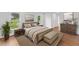 Stylishly furnished primary bedroom with a large bed, hardwood floors, and contemporary décor at 314 Lane Rd, Dunn, NC 28334