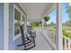 Cozy front porch featuring comfortable rocking chairs and a serene view of the surrounding landscape at 314 Lane Rd, Dunn, NC 28334