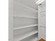 Walk-in closet with multiple shelves and hanging rods to maximize space and organization at 314 Lane Rd, Dunn, NC 28334