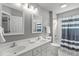 Bathroom features dual sinks, framed mirrors and a shower/tub combo at 321 Commons Walk Cir, Cary, NC 27519