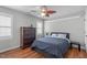 Bedroom with hardwood floors, stylish ceiling fan and plenty of natural light at 321 Commons Walk Cir, Cary, NC 27519
