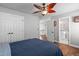 Bedroom with hardwood floors, ceiling fan, ensuite and walk-in closet at 321 Commons Walk Cir, Cary, NC 27519