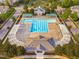 Aerial view of the neighborhood pool and lounge area with ample seating and a well-maintained pool house at 321 Commons Walk Cir, Cary, NC 27519