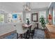 Elegant dining room featuring a modern chandelier, stylish decor, and a seamless flow to living spaces at 321 Commons Walk Cir, Cary, NC 27519