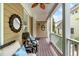 Cozy front porch featuring stylish seating, wood floors, ceiling fan, and white railing at 321 Commons Walk Cir, Cary, NC 27519