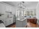 Open concept kitchen flows into a living area with lots of light and modern decor at 321 Commons Walk Cir, Cary, NC 27519