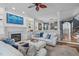 Cozy living room features a fireplace, built-in shelving, and adjacent dining area at 321 Commons Walk Cir, Cary, NC 27519