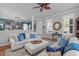 Spacious living room includes plantation shutters, fireplace, and staircase at 321 Commons Walk Cir, Cary, NC 27519