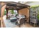 Inviting outdoor lounge under a gazebo with comfortable seating, a fire pit, and elegant design for relaxation at 321 Commons Walk Cir, Cary, NC 27519