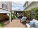 Charming patio with a gazebo, comfortable lounge chairs, and lush greenery, creating a relaxing outdoor space between homes at 321 Commons Walk Cir, Cary, NC 27519