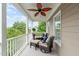 Covered porch with ceiling fan and comfortable seating at 321 Commons Walk Cir, Cary, NC 27519