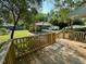 View of the backyard from the deck with basketball hoop and detached carport at 3810 Pendergrass St, Durham, NC 27704