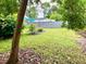 View of backyard showcasing a grassy yard and foliage at 3810 Pendergrass St, Durham, NC 27704
