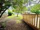 Inviting backyard featuring a wooden deck and a shady tree at 3810 Pendergrass St, Durham, NC 27704