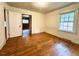 View of a bedroom showing the hardwood floors and natural light at 3810 Pendergrass St, Durham, NC 27704