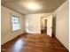 Bedroom featuring hardwood floors and natural light coming through the window at 3810 Pendergrass St, Durham, NC 27704