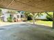 View from the carport of the home with deck and backyard at 3810 Pendergrass St, Durham, NC 27704