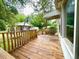 View of the wooden deck and railing, with a basketball hoop in the back at 3810 Pendergrass St, Durham, NC 27704