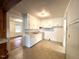 Modest kitchen features white cabinets, laminate countertops, and ample natural light at 3810 Pendergrass St, Durham, NC 27704