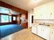 The Kitchen has white cabinets with a view into the Gathering room at 3810 Pendergrass St, Durham, NC 27704