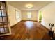 Spacious living room featuring hardwood floors, a large window, and an open layout at 3810 Pendergrass St, Durham, NC 27704