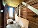 Interior view of the unfinished storage area with wooden walls and ceiling at 3810 Pendergrass St, Durham, NC 27704