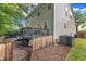 Exterior view of a home featuring a deck, patio, and privacy fence in the backyard at 4028 Winecott Dr, Apex, NC 27502