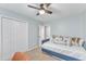 Comfortable bedroom featuring a daybed, a closet and light-filled windows at 4028 Winecott Dr, Apex, NC 27502
