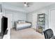 Well-lit bedroom includes a daybed, storage and bright, airy windows at 4028 Winecott Dr, Apex, NC 27502