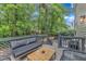 Outdoor deck featuring patio furniture and a staircase leading to a backyard area at 4028 Winecott Dr, Apex, NC 27502