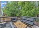 Inviting deck with seating and wooded views, perfect for outdoor relaxation and entertaining at 4028 Winecott Dr, Apex, NC 27502