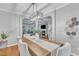 Elegant dining area with a clear view into the living room, highlighting the open floor plan and natural light at 4028 Winecott Dr, Apex, NC 27502